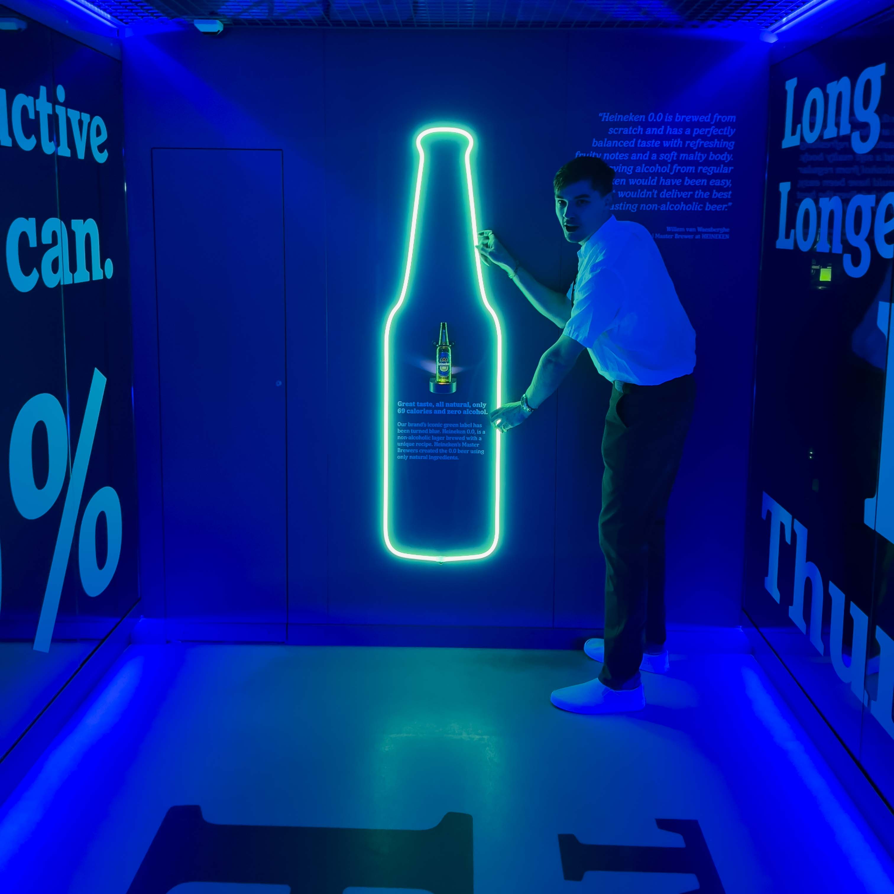 Ryan, holding onto a large Heineken light